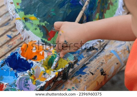Kids playing painting with Color plate make inspiration child skill development