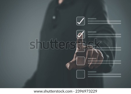 Businessman touch screen tick correct sign mark for document approve , project acceptance and quality assurance concept, Take an assessment, questionnaire, evaluation, online survey online exam. Royalty-Free Stock Photo #2396973229
