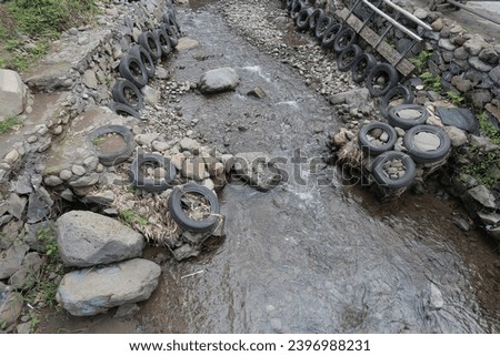 Rivers, running water, rocks and old tires act as barriers to erosion