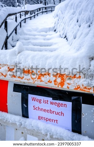 warning sign in german - translation: path closed due to snowfall - photo