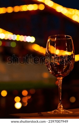 Wine glass and evening lights in the night