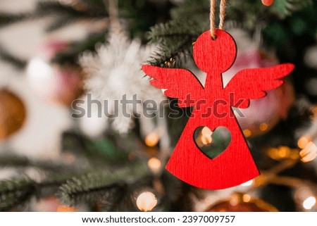 Close up shot of Christmas tree decoration angel toy. Merry Christmas and Happy New Year. Winter magic and happiness of celebration winter holiday. Fir tree ornaments