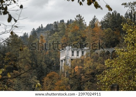 Cafe Belvedere upper terrace, Villa Bled Resort, Slovenia. It is former summer tea house of Marshal Tito, President of former Yugoslavia, located on shores of lake Bled. Autumn foggy time. Royalty-Free Stock Photo #2397024911