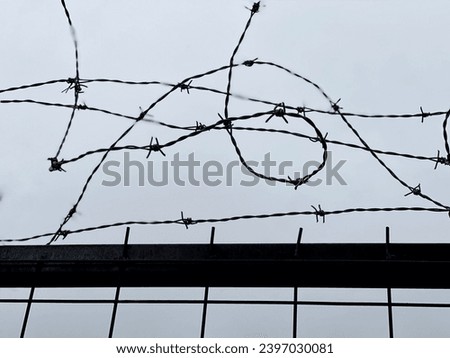 close up of barbed wire fence with defocus background