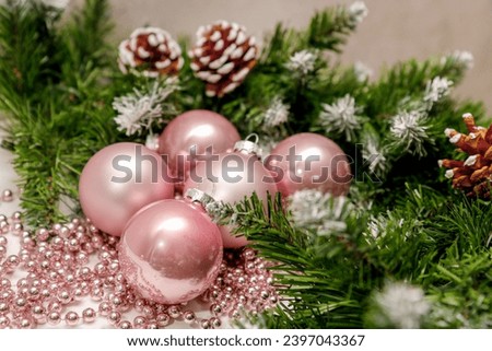 pink New Year balls with fir branches and pine cones, New Year, Christmas background.