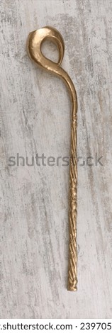 golden magic staff on wooden background