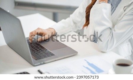 Business person typing on laptop keyboard working with digital data..
