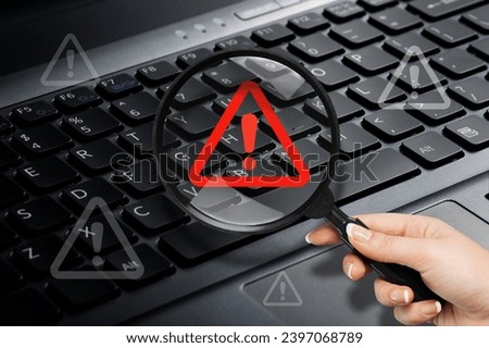 Red triangle warning sign on computer keyboard