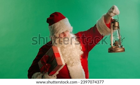 Santa Claus With Lantern In Snowy Night on green background.