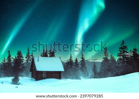 Snowy pine trees and a wooden hut on a mountain meadow in a wintery scene. Aurora borealis. Northern lights in winter forest. Christmas holiday and winter vacations concept