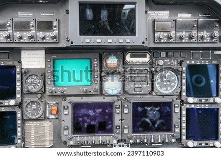 Interior view of helicopter Agusta cockpit dashboard with buttons, switches, faders, displays, selected focus, control panel, copter dashboard Royalty-Free Stock Photo #2397110903