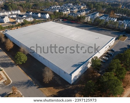 Drone Photos of Commercial Roofs Featuring Shingles and Metal in Unique Shapes and Large Surface Area.  Royalty-Free Stock Photo #2397125973