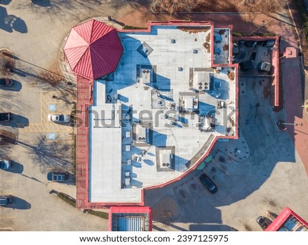 Drone Photos of Commercial Roofs Featuring Shingles and Metal in Unique Shapes and Large Surface Area. 