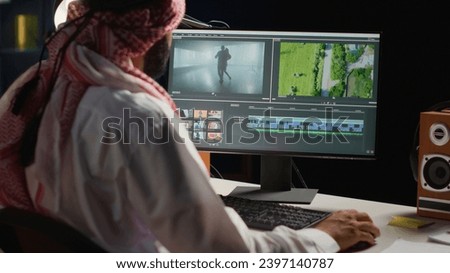 Arabic cinematographer editing new project, creating film montage, working with footage and sound. Man using post production software to process movie on computer workstation
