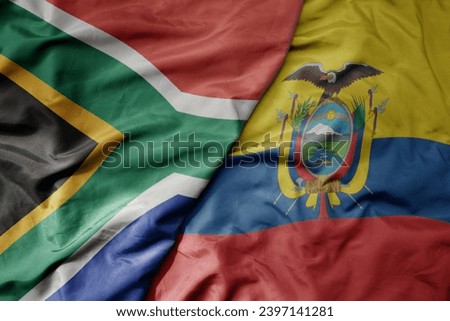 big waving national colorful flag of ecuador and national flag of south africa . macro