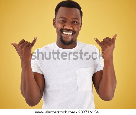 Man, portrait and cool hand gesture in studio on yellow background for hang loose, good mood or relax weekend. Black person, model and face for finger emoji for chill out, stress relief or greeting