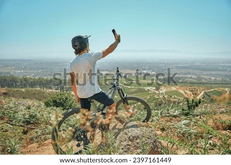 Fitness, selfie and man on a bicycle with phone for cycling, photography or photo in nature. Cyclist, workout and social media health influencer live streaming for blog, website or profile picture