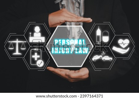 Personal injury law concept, Business woman hand holding personal injury law icon on virtual screen. Royalty-Free Stock Photo #2397164371