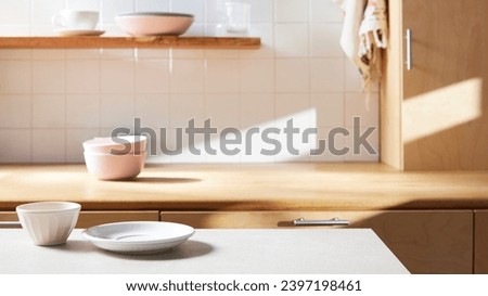 A sunny kitchen with white tile walls, a wooden table and sink. Royalty-Free Stock Photo #2397198461