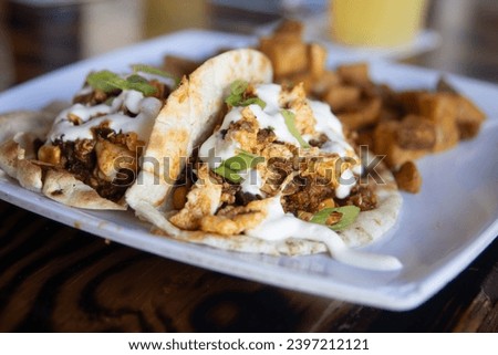 Breakfast Pork Tacos served with potatoes
