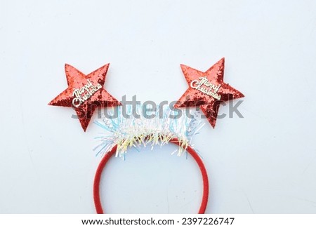 decorated Beautiful headband funny red star isolate on a white backdrop.
concept of joyful Christmas party,New year is coming soon, festive season decoration with Christmas elements