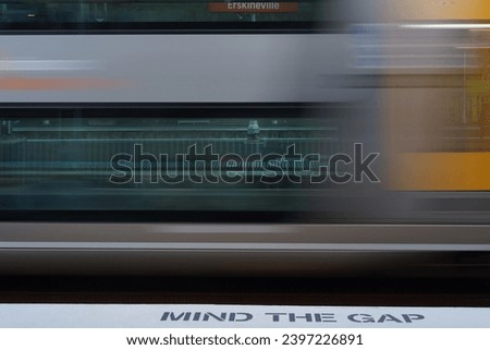 Sydney train running past Erskineville station captured with a slow shutter speed