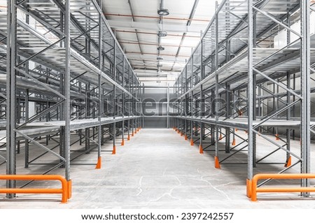 Metal shelving in a warehouse. Empty storage facilities  Royalty-Free Stock Photo #2397242557