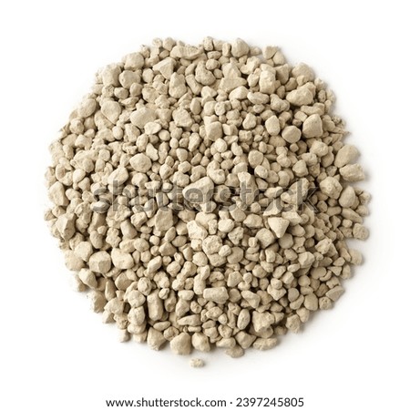 Mineral cat litter filler on white background Royalty-Free Stock Photo #2397245805