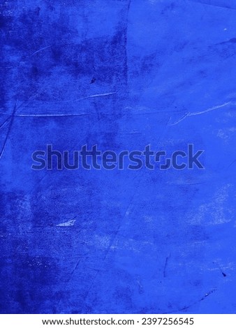 Blue paint that had been applied to paper using a paint roller.
The rolled paint creates an imperfect surface, making it a great background texture for grunge or distressed designs.