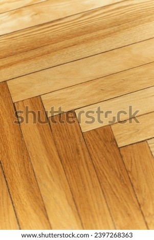Wooden parquet floor background. Old vintage parquet on the floor in the living room. Interior design concept.