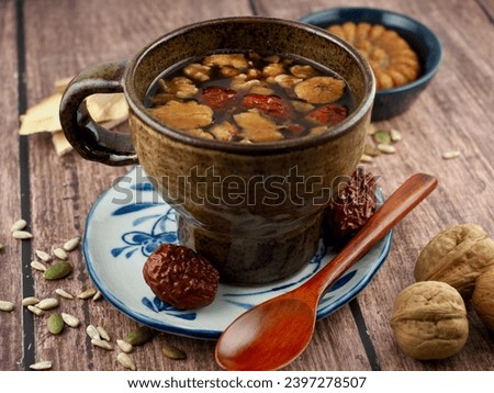 Korean traditional beverage Ssanghwa tea and dried jujube Royalty-Free Stock Photo #2397278507