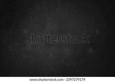 Old black grunge background. Dark concrete wall tetxure. Blackboard for a white text