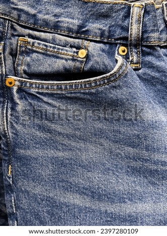 Front view fashion blue jeans pocket texture close up