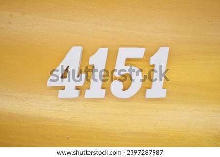 The golden yellow painted wood panel for the background, number 4151, is made from white painted wood.