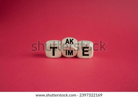 Take your time symbol. Concept word Take Time on wooden cubes. Beautiful red table red background. Business and Take your time concept. Copy space.