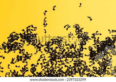 scattered note music on a yellow background, musical background