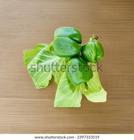 Capsicum with cabbage leaves image.