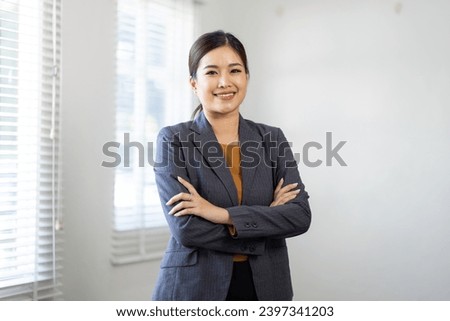 Young asian woman, professional entrepreneur standing in office clothing, smiling and looking confident, home office background