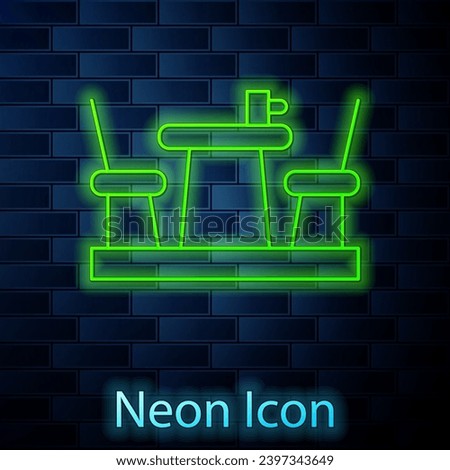 Glowing neon line French cafe icon isolated on brick wall background. Street cafe. Table and chairs.  Vector
