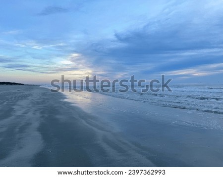 Sunrise ocean winter beach morning beautiful  Royalty-Free Stock Photo #2397362993
