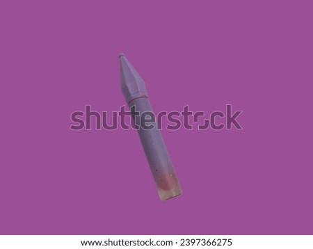 A very attractive lipstick with a unique purple shape