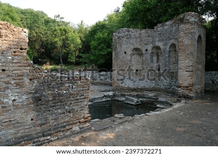 Ruins of the Great Basilica in Butrint National Park, Buthrotum, Albania. Triconch Palace at Butrint Life and death of an ancient Roman house Historical medieval Venetian Tower surrounded Royalty-Free Stock Photo #2397372271
