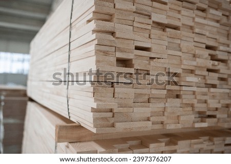 A vast warehouse in the forestry industry, showcasing a plethora of wooden products, including boards and various timber items neatly organized in storage Royalty-Free Stock Photo #2397376207