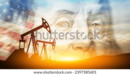 Oil price cap concept. Petroleum, petrodollar and crude oil concept. Oil pump on background of US dollar and USA flag. Dollar and oil pumps Royalty-Free Stock Photo #2397385601