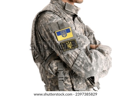 Male soldier with Ukrainian chevrons isolated on white background