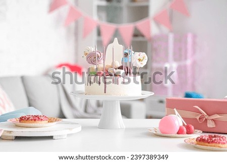Stand with Birthday cake on table in room, closeup