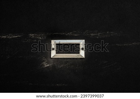 blank metal nameplate or name-board on black background