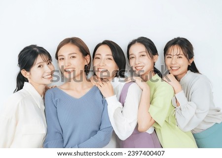 Portrait of group of middle aged Asian women with colorful clothes. Skin care. Cosmetics. Anti-aging. Royalty-Free Stock Photo #2397400407