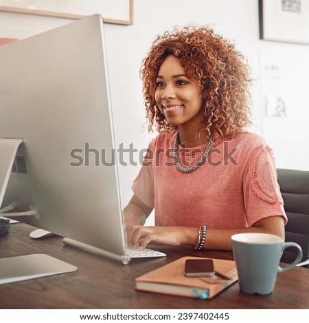 Workplace, happy or designer with computer for research, editing or copywriting on blog or website. Startup, smile or African woman in office working on internet update, networking or reading news