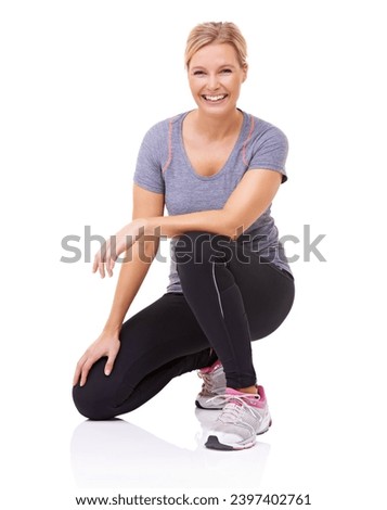 Studio, portrait and woman in gym clothes with happy, health wellness and fitness with mockup. Person, smile and face with training or sports fashion, exercise gear and sneakers by white background Royalty-Free Stock Photo #2397402761